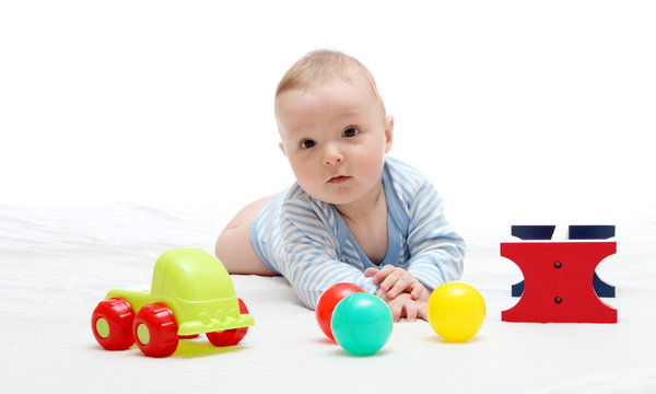 Beautiful baby playing with toys