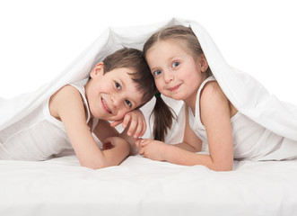 cheerful children in bed