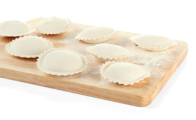Obraz na płótnie Canvas Raw dumplings on wooden desk, isolated on white