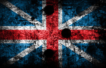 flag painted on brick wall with bullet holes © Piotr Krzeslak