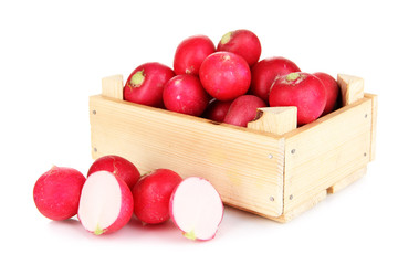 Small garden radish in wooden box isolated on white
