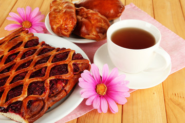 Cherry Pie with tea on table close-up