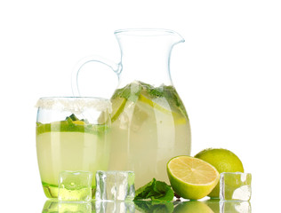Lemonade in pitcher and glass isolated on white