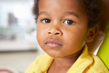 Portrait Of Happy Young Boy At Home