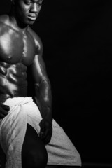 Fototapeta na wymiar Muscular male model wrapped in a towel