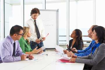 Businessman Conducting Meeting In Boardroom