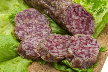 Salami with rosemary, salad and tomatoes