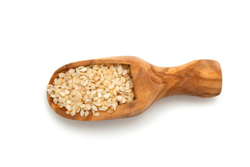 sesame seeds in a wooden scoop