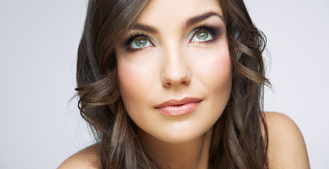 Fototapeta premium Woman face close up beauty portrait. Girl with long hair lookin