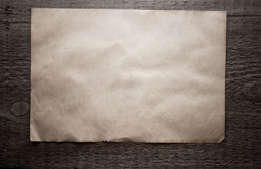 paper on wooden background