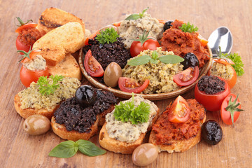 assortment of olive spread and toast