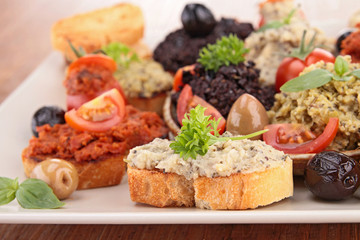 assortment of olive spread and toast