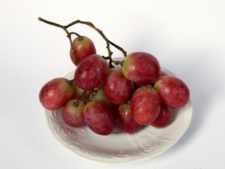 Grapes on the white plate