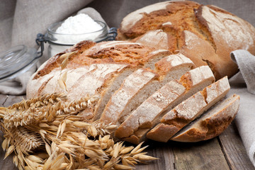 Fresh bread on wooden ground