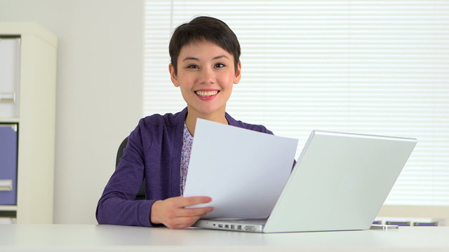 Chinese businesswoman working on her laptop