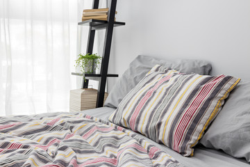Shelf decorating a bright modern bedroom
