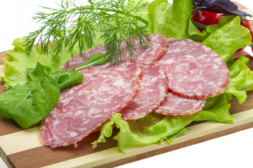 Sausages with salad and basil