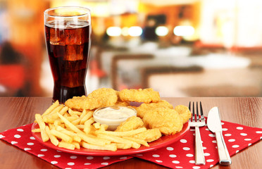 Fried chicken nuggets with french fries,cola and sauce