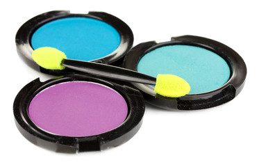 Bright eye shadows and sponge brushes for foundation isolated