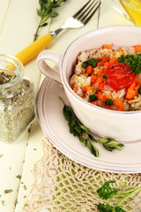 Delicious rice with vegetables and herbs in pot