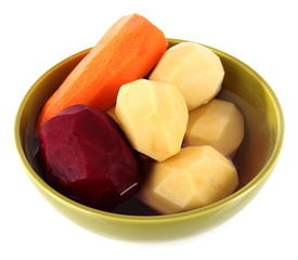 Peeled vegetables in bowl isolated on white