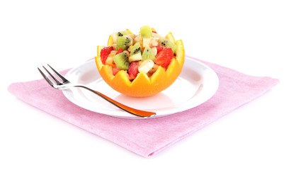 Fruit salad in hollowed-out orange isolated on white