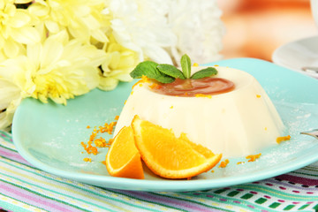 Panna Cotta with orange zest and caramel sauce,