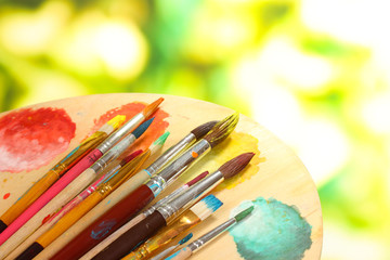 Many brush in paint close-up