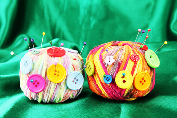 Colorful buttons and multicolor wool balls,