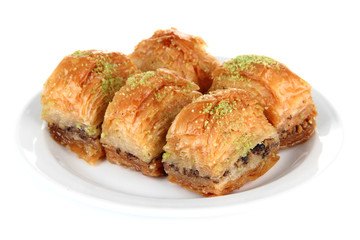 Sweet baklava on plate isolated on white