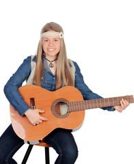 Fototapeta premium Pretty girl with hippie clothes and a guitar