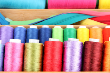 Sewing accessories in wooden box close up