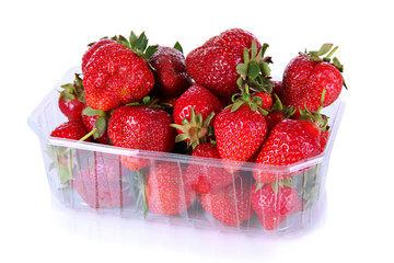 Strawberries in plastic box isolated on white