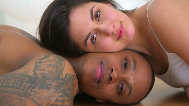 Close up of African American and Caucasian couple lying down