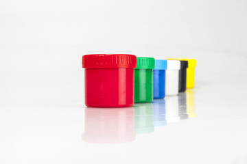 red and green paint boxes with brushes