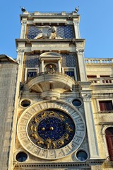 Clock on the wall of the house at St. Mark's Square.