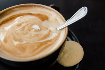 Cup of caffe crema with biscotti