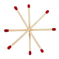 Matchsticks with red heads grouped in a star