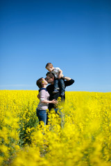 happy family in blooming field