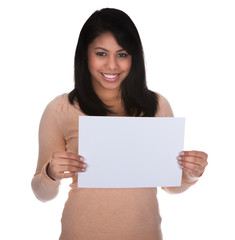 Naklejka premium Young Woman Pointing At Placard