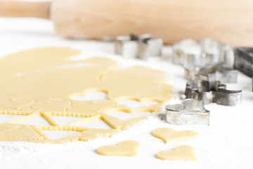 still life of dough with cookie cutters