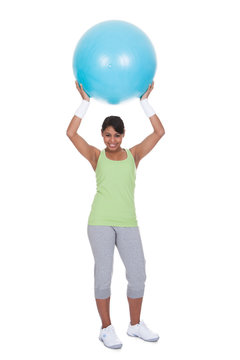 Young Woman Exercising With Pilates Ball