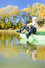 fishing woman sitting on boat