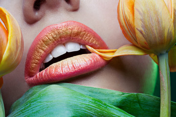 Orange female lips and tulips