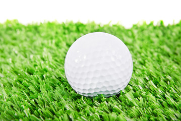 Golf ball on green golf field