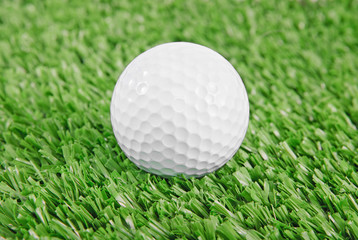 Golf ball on green golf field