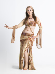 woman with curves dancing an oriental dance belly dancer