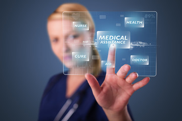 Young nurse pressing modern medical type of buttons
