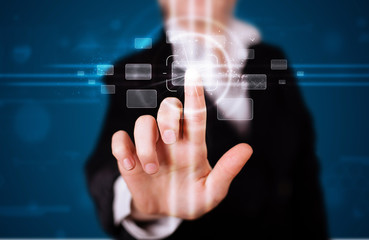 Woman pressing high tech type of modern buttons