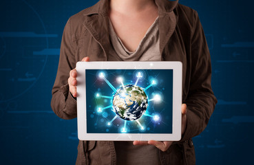 Woman presenting 3d earth globe in modern tablet